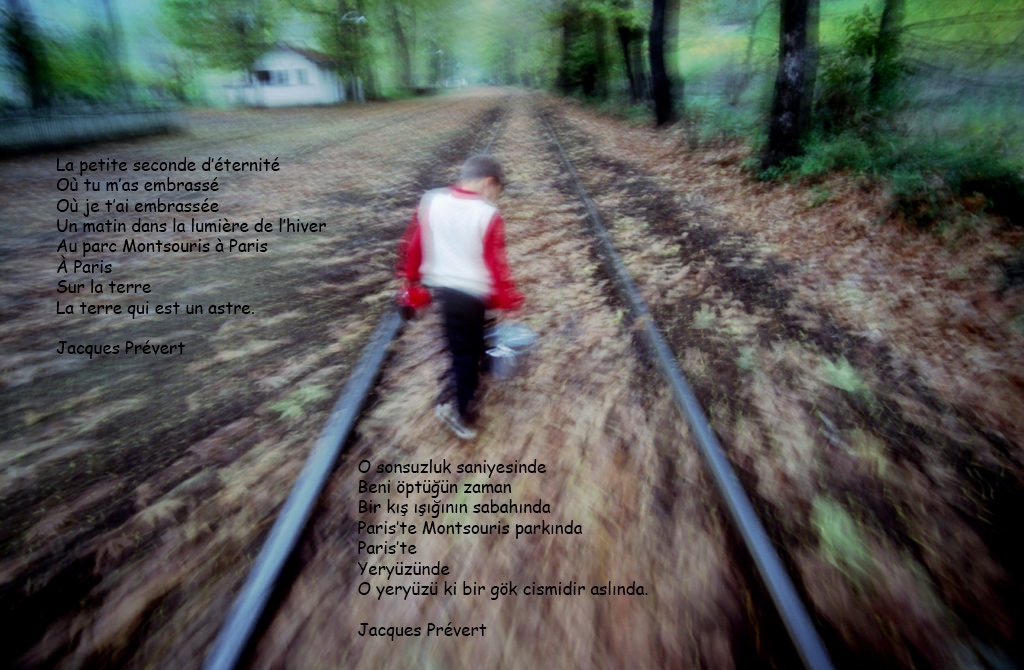 Journey, 1995. A boy walks on a railway line. The photograph carries a poem by Jacques Prévert in French and Turkish.
